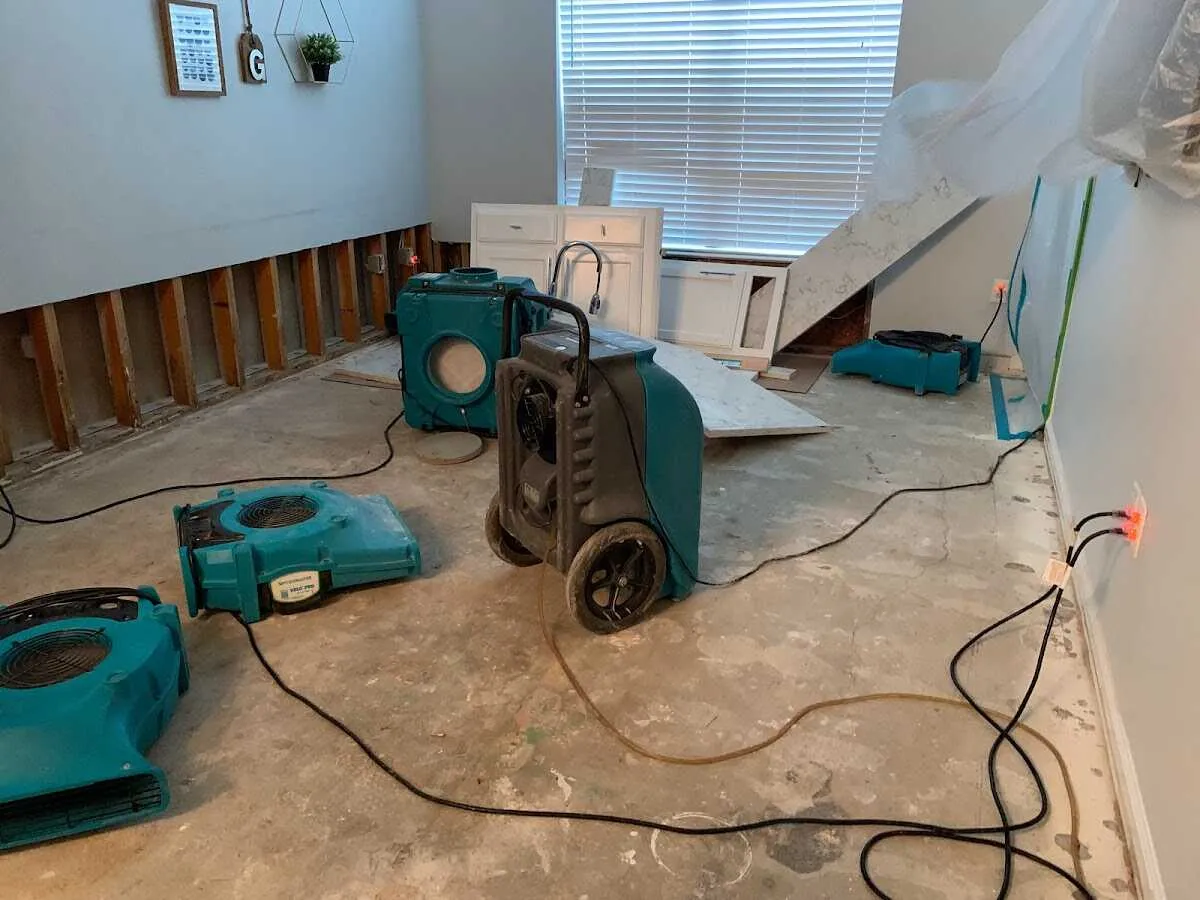 Dehumidifier in flood-cut room for Water Damage Restoration in Center