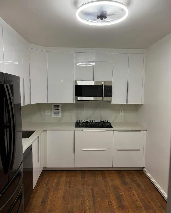 Renovated kitchen with quartz countertops in Center